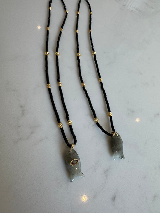 Black fish charm necklace