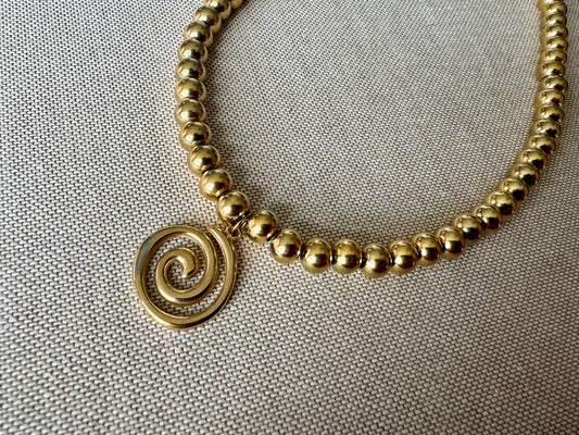 70s retro swirl necklace in gold